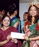 Subrina, receiving her round trip ticket to India from Seema Andhare