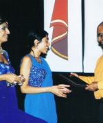 Shilpa Patel (choreographer), recieving an appreciation plaque from Promod Gupta Regional Director Of Air India while MC Priya Issac looks on