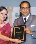 Mrs. Seema Andhare, Regional Director, Air-India, being honored by the Chairman Dharmatma Saran