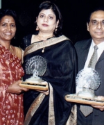 Lifetime achievement award, Neelam & Dharmatma Saran recieving a lifetime achievement award "For Bringing The International Indian Community On One Platform Through Pageantry" from Shirley Naidoo