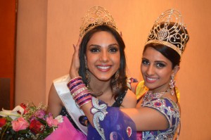 Monica Gill being crowned by outgoing queen, Nehal Bhogaita